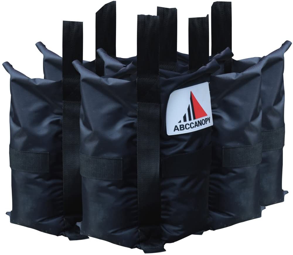 This photo displays a set of 4 sand weight black bags, each featuring the ABCCANOPY logo, designed for use with pop-up canopies. These weight bags are essential accessories for stabilizing and securing your canopy, providing stability and peace of mind during outdoor events and gatherings.