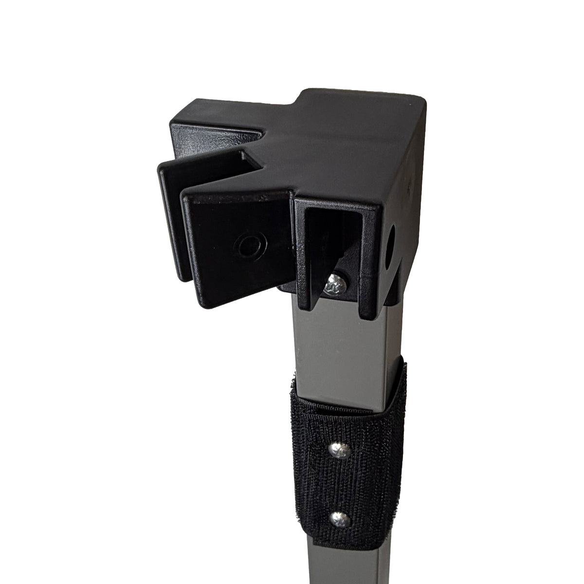 Close-up of a black plastic mounting bracket attached to a gray metal pole with a black velcro strap, shown on a plain white background.
