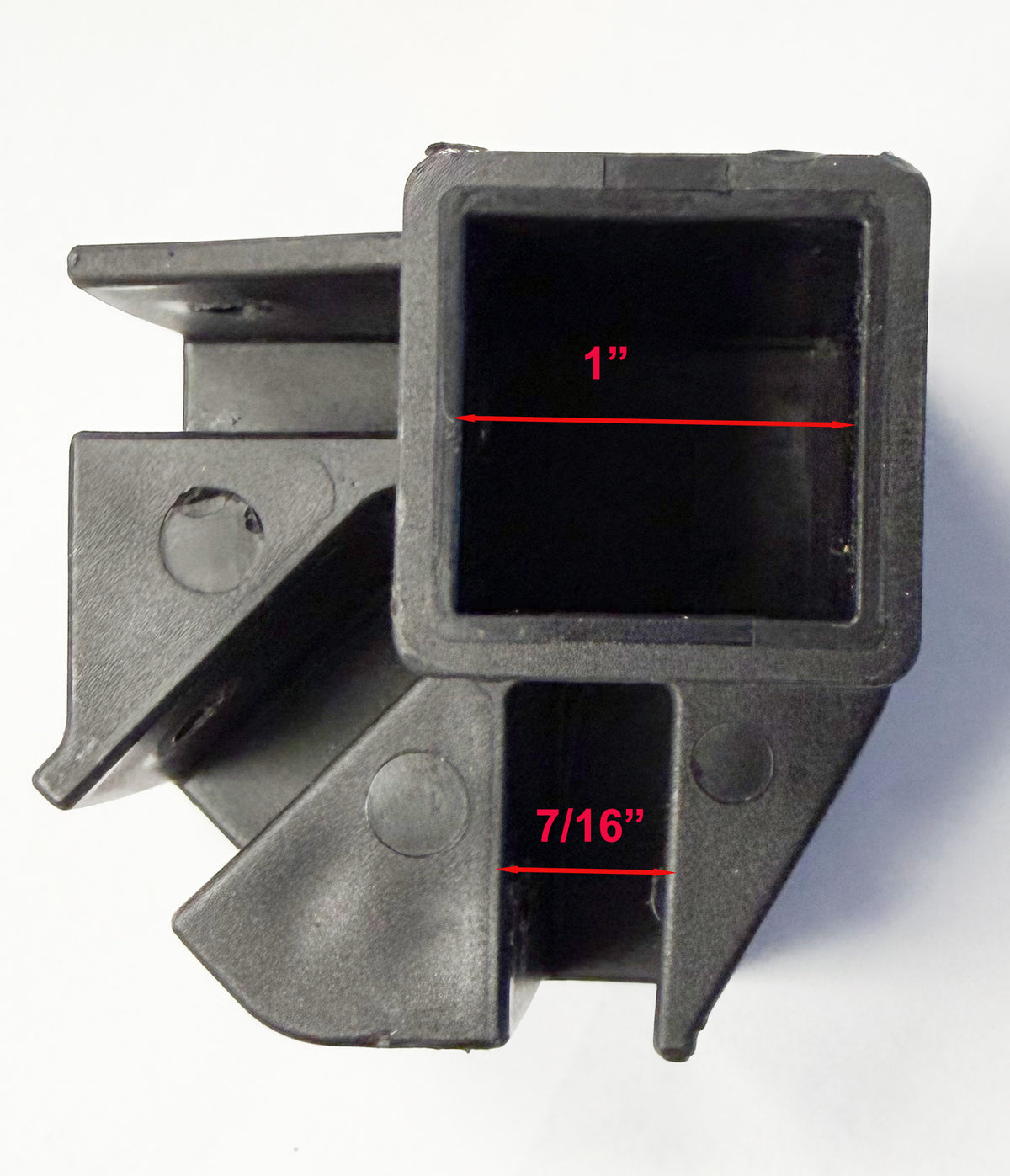 A black plastic square pipe coupler with red dimension lines indicating a 1-inch inner diameter and 7/16-inch outer diameter, shown on a white background.